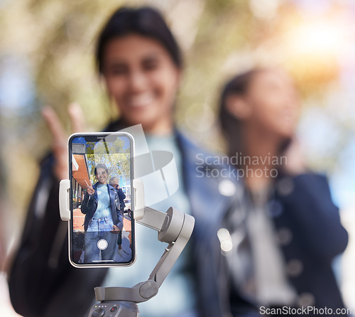 Image of Portrait, friends and phone selfie with peace sign in city, smile and bond together outdoor. Smartphone, profile picture and girls or women with photography for happy memory, v emoji or social media