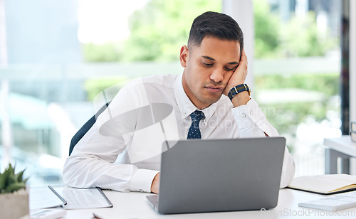 Image of Bored, tired and business man at laptop in office with stress, anxiety or burnout for tax audit. Lazy, sad and frustrated employee working at computer with challenge, problem or fatigue of boring job