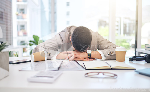 Image of Tired business man sleeping at desk with burnout, stress problem and low energy in office. Fatigue, frustrated and sad male employee in nap for bad time management, deadline and depression of mistake