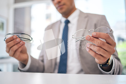 Image of Optometry, choice and closeup of a man with glasses for eye care, optical wellness or health. Vision, healthcare and zoom of a male person choosing frame for prescription spectacles or lens in store.