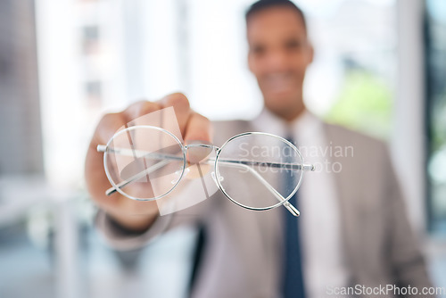 Image of Professional, man and glasses in hand in closeup at corporate office with clear vision in blurry background. Lens, eye care and business man holding prescription for sight or maintenance.