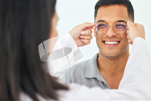 Image of Eye care, glasses and happy man with lens from optician for vision, eyesight and optical frames. Face of customer, optometrist and check spectacles for prescription assessment, test eyes and services