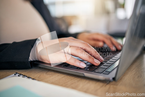 Image of Closeup, hands and typing on a laptop at a desk for secretary work, email check or connection. Office, business and a corporate employee or receptionist with a computer for a website or research