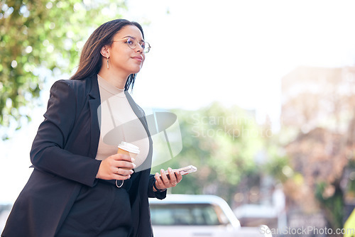 Image of Business woman, phone and coffee in city walking to work with social media, email and networking online. Young professional worker, employee or person for carbon footprint travel and mobile chat