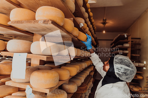 Image of Arab investor in a warehouse of the cheese production industry