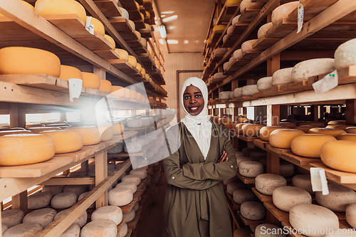 Image of Arab investor in a warehouse of the cheese production industry