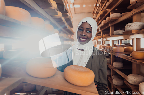 Image of Arab investor in a warehouse of the cheese production industry