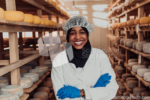 Image of Arab investor in a warehouse of the cheese production industry