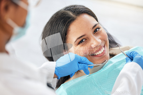Image of Dentist, dental care and teeth smile of a woman with tools and hands of a professional by mouth. Portrait of a female patient for orthodontics, healthcare and cleaning or inspection for oral health