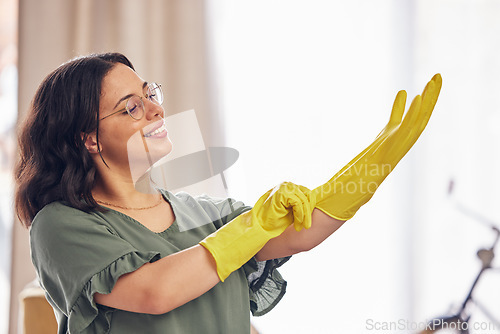 Image of Woman, hand and gloves for cleaning service in home for safety from germs, bacteria in living room. Happy, girl and disinfect in apartment for dirt with household maintenance for dust or virus.