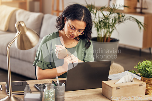 Image of Wrist pain, stress and laptop with woman in home office for injury, emergency and accident. Burnout, muscle and tension with female employee and arm massage for carpal tunnel, joint and inflammation