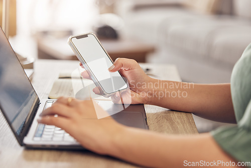 Image of Hands, typing on laptop with phone and remote work, freelancer checking email screen or social media mockup. Networking, online research in virtual space and technology with mobile app in home office