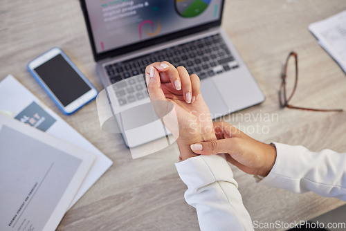 Image of Hands, business woman and pain in wrist from typing on laptop, orthopedic injury or health risk from above. Closeup of worker, carpal tunnel and muscle problem from stress, fibromyalgia and arthritis