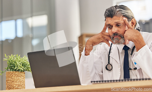 Image of Senior doctor man, laptop and headache with stress, 404 glitch or connectivity problem in hospital office. Mature medic, pc and reading bad results for thinking, anxiety and fear in healthcare job