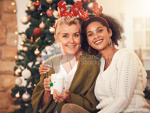 Image of Portrait, christmas and blended family with a woman and daughter in law together in a home during the festive season. Smile, love and diversity with happy people in a house for december celebration