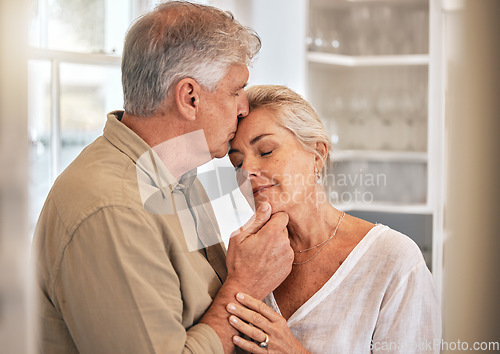 Image of Home, kiss and senior couple with love and commitment while together for quality time and bonding. Elderly woman and a man relax in a room with care, support and security in a healthy marriage