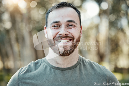 Image of Portrait, smile and a man in nature during summer for travel, freedom or adventure in the wilderness. Face, happy and a male hiking in the forest or woods for adventure, holiday or vacation outdoor