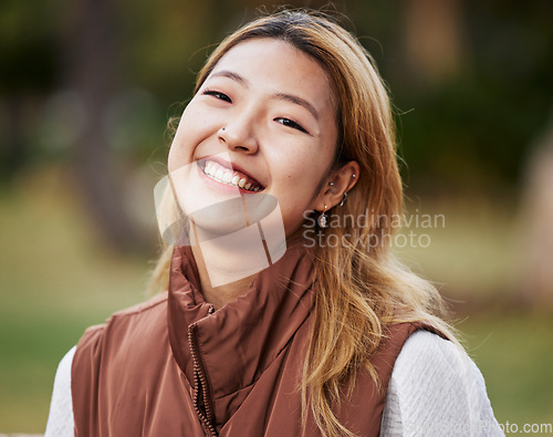 Image of Happy, smile and portrait of Asian woman in park for holiday, freedom and relaxing outdoors. Happiness, nature and face of female person with joy, confidence and positive mindset for travel in summer
