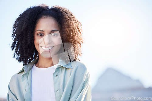 Image of Happy, summer and portrait of a woman in the city for sun, smile and vacation with mockup. Travel, morning and headshot of a young girl with space for advertising on bokeh on a urban holiday