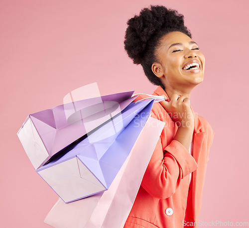 Image of African woman, studio and smile shopping bag with discount, sale and thinking by pink background. Young gen z girl, retail promotion and happy for deal, customer experience and fashion for gift idea