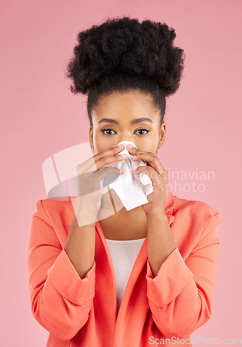 Image of Woman, tissue and sneeze in studio portrait for healthcare, hygiene and allergy by pink background. African gen z girl, sick student or model with toilet paper, blowing nose or cleaning for self care