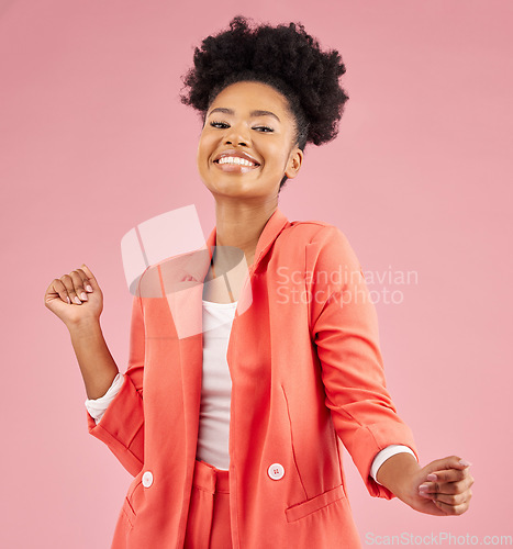 Image of Smile, dancing and portrait of a woman in a studio with music, playlist or album for celebration. Happiness, excited and young African female model moving to a song isolated by a pink background.