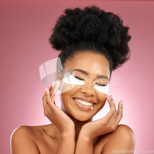 Image of Skincare, happiness and black woman with mask on eyes, cosmetics and dermatology on pink background. Beauty, collagen product and model eye patches for healthy skin glow, smile and care in studio.