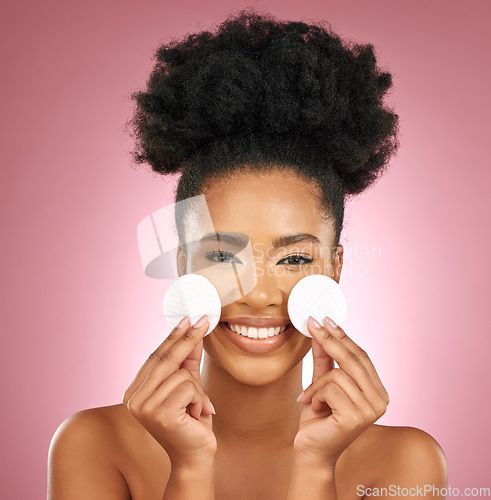 Image of Portrait, cotton pad and black woman with skincare, makeup and dermatology on a studio background. Female person, face or model with cosmetics, aesthetic and cleaning with wellness, shine and patches