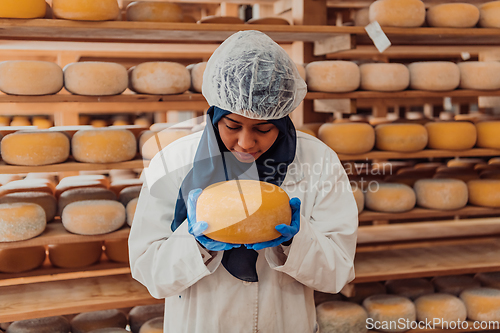 Image of Arab investor in a warehouse of the cheese production industry