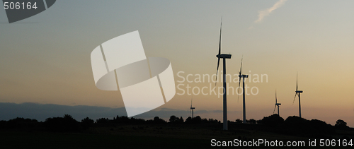 Image of windturbines on sunset