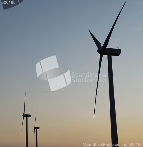 Image of windturbines on sunset sky