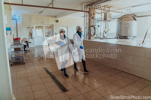 Image of Arab business partner visiting a cheese factory. The concept of investing in small businesses