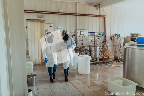 Image of Arab business partner visiting a cheese factory. The concept of investing in small businesses