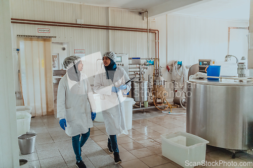 Image of Arab business partner visiting a cheese factory. The concept of investing in small businesses