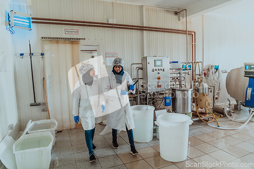 Image of Arab business partner visiting a cheese factory. The concept of investing in small businesses