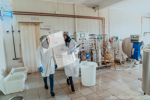 Image of Arab business partner visiting a cheese factory. The concept of investing in small businesses