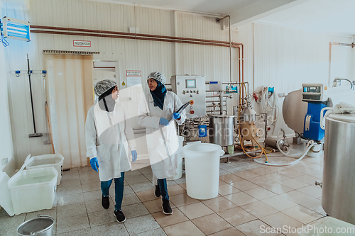 Image of Arab business partner visiting a cheese factory. The concept of investing in small businesses