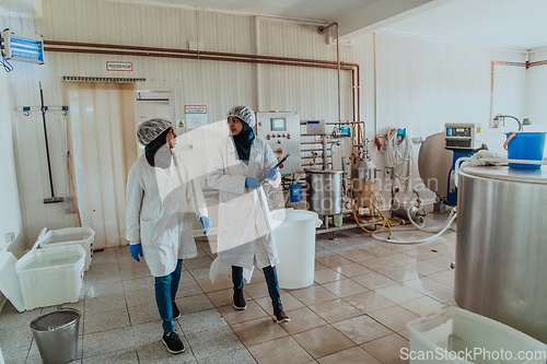 Image of Arab business partner visiting a cheese factory. The concept of investing in small businesses