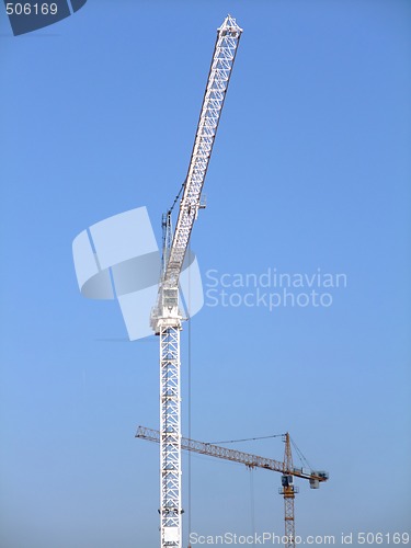 Image of Two construction cranes 