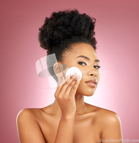 Image of Black woman, cotton pad and portrait with makeup, dermatology and skincare on a studio background. Female person, shine and model with cosmetics, aesthetic and cleaning with beauty, glow and patches