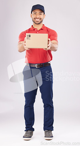 Image of Happy, shipping box or portrait of delivery guy in studio with courier service, supply chain package or smile. Full body, white background or man with distribution, online shopping or mail services