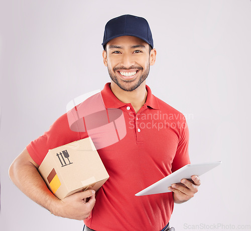 Image of Asian man, portrait and box with tablet for delivery, digital signature or checklist against a grey studio background. Male person smile with supply chain technology, parcel or package for logistics