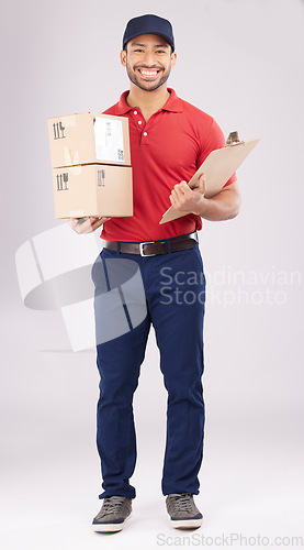 Image of Happy asian man, portrait and box in delivery with clipboard for checklist against a white studio background. Male person smile in supply chain for courier service, parcel or package and logistics