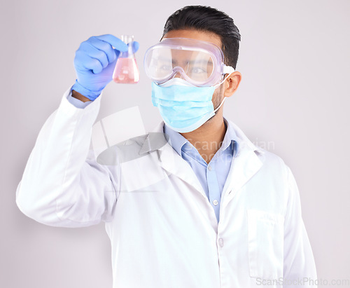 Image of Medical, chemical and man with research, test and scientific breakthrough against a white studio background. Research, male person and model with safety, cure and container with liquid and chemistry