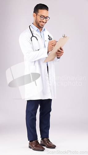 Image of Happy man, doctor or writing on clipboard in studio, planning documents or medical schedule. Asian healthcare worker with test report of insurance, clinic notes or medicine script on white background