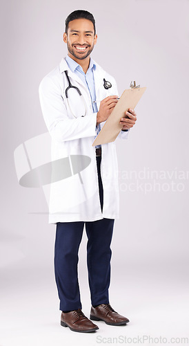 Image of Happy asian man, portrait or doctor with clipboard in studio, planning notes or medical information. Healthcare worker smile for report of insurance checklist, documents or script on white background