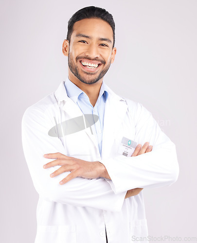 Image of Man, portrait and scientist smile with arms crossed in studio isolated on a white background. Confidence, face and Asian doctor of science, research expert or happy medical professional from Cambodia