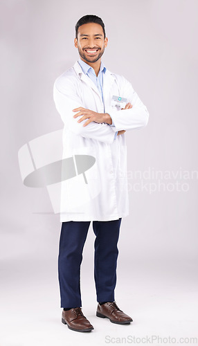 Image of Portrait, man and happy scientist with arms crossed in studio isolated on a white background. Confidence, smile and Asian doctor, science expert or medical professional from Singapore on mockup space