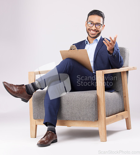 Image of Psychologist, therapist and a man with a chair and clipboard for therapy, consultation or support. Portrait of professional person with notes for mental health counselling on white studio background