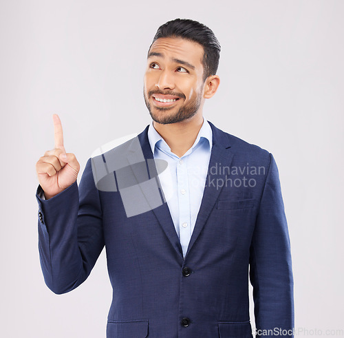 Image of Solution, pointing and presentation with business man in studio for idea, advertising and news. Question, space and announcement with person on white background for promotion, mockup and information